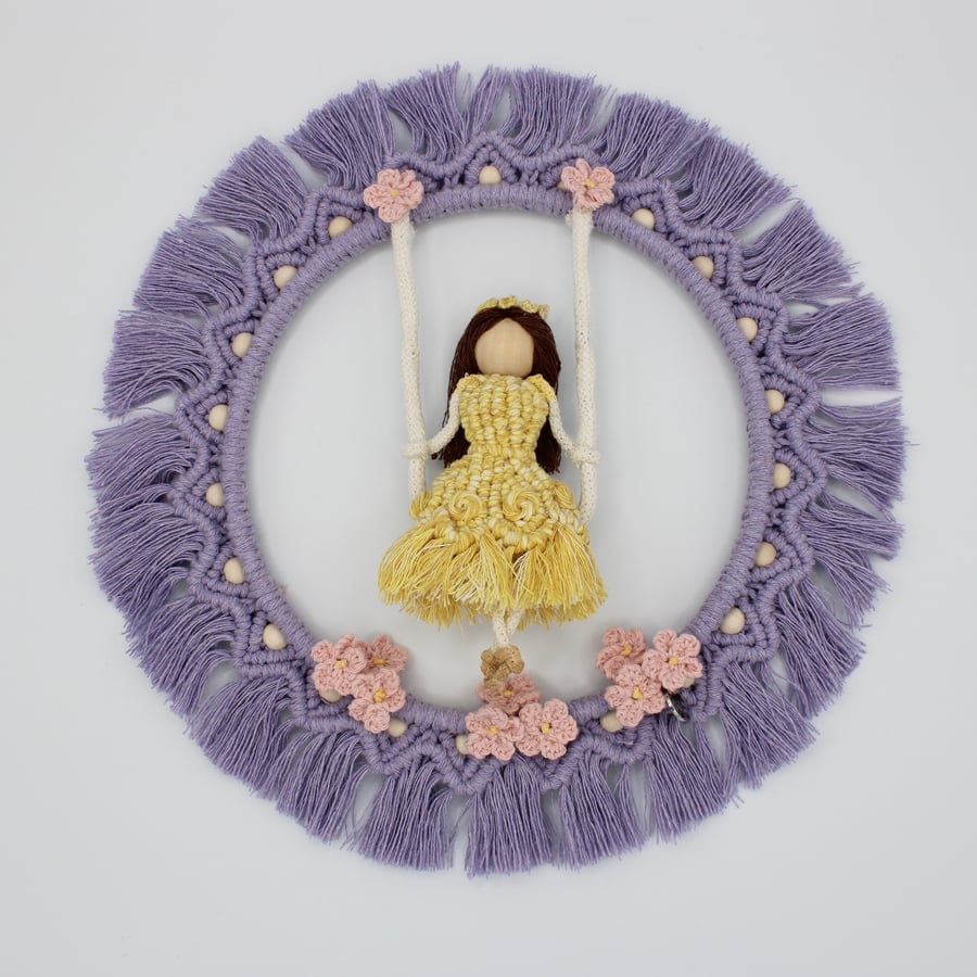 Macrame ring wall decoration, girl on a swing, decorative lilac macrame ring