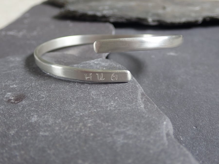 HUG Hand Stamped Recycled Sterling Silver Open Bangle, secret hearts 