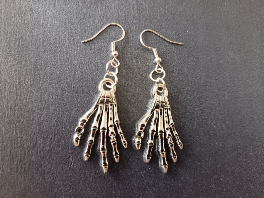 Silver skeleton hand dangle earrings 