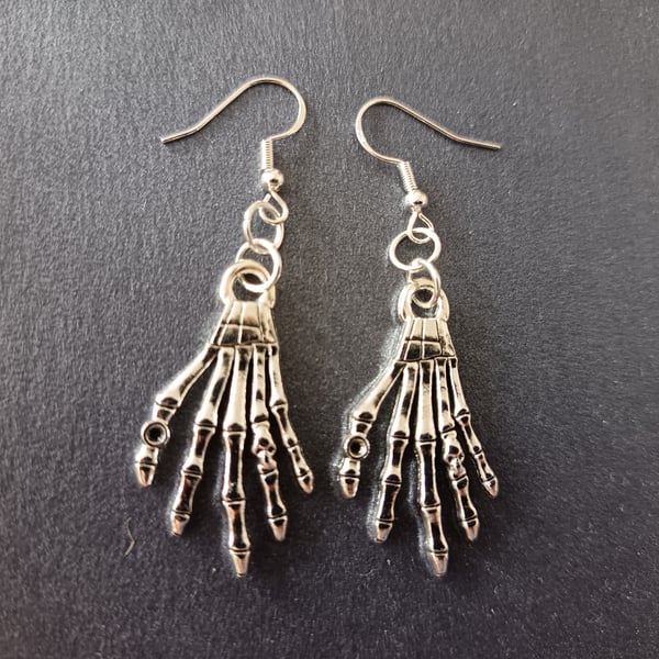 Silver skeleton hand dangle earrings 