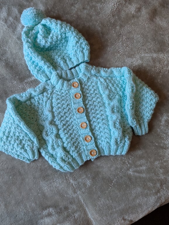 Baby's cable cardigan with matching hat 