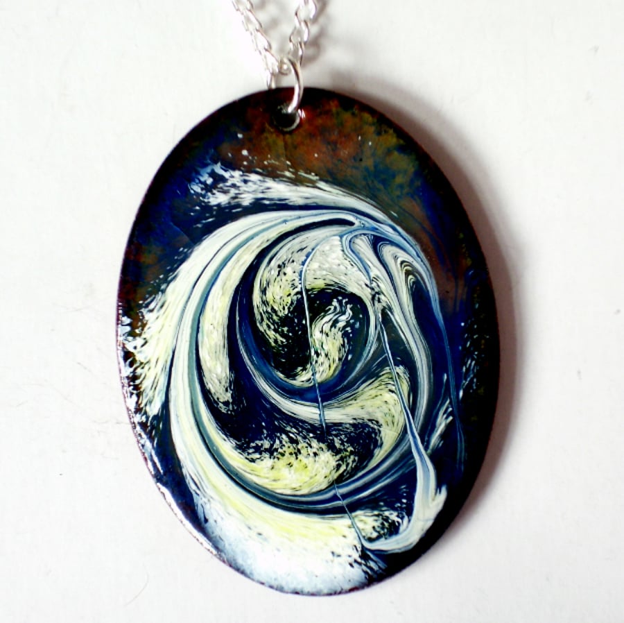 enamel pendant - oval scrolled white and gold on dark blue over clear