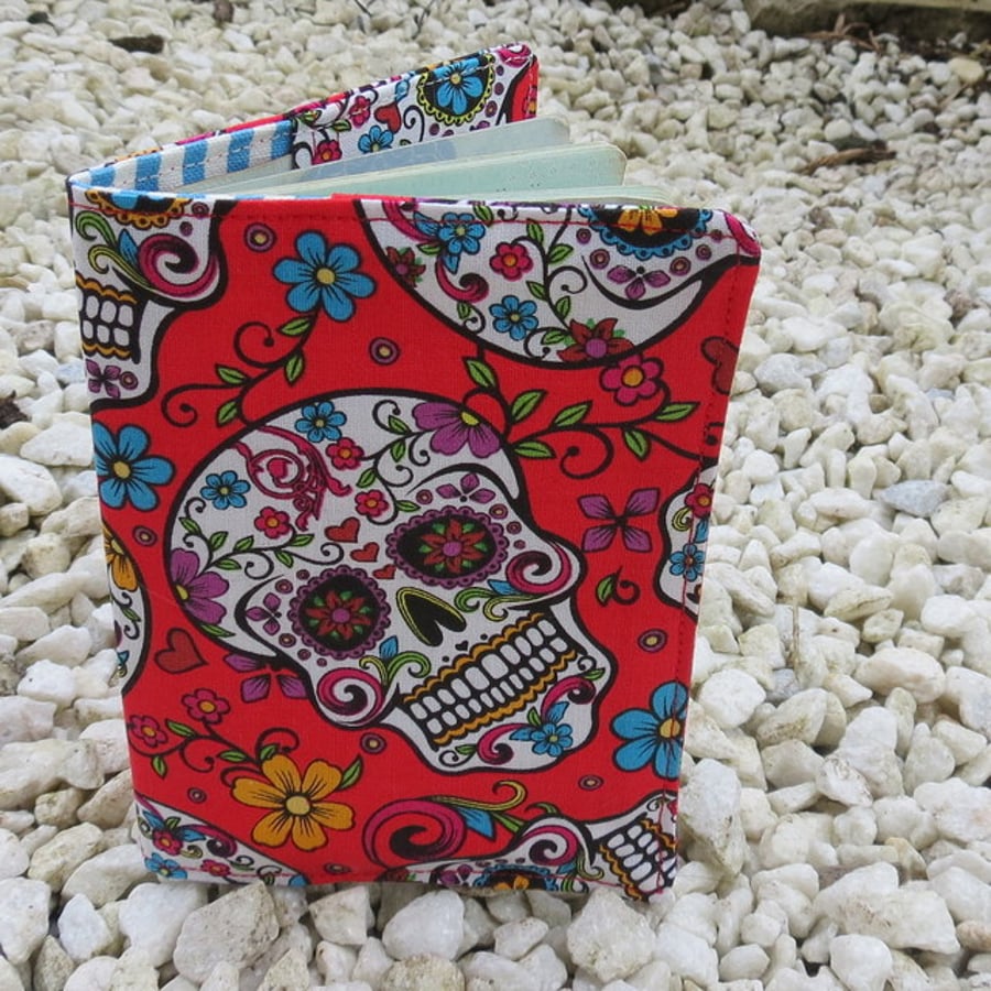 Skulls.  A passport sleeve made from a vibrant Sugar Skulls cotton.