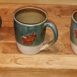 Generous and beautiful oak leaf decorated stoneware mugs