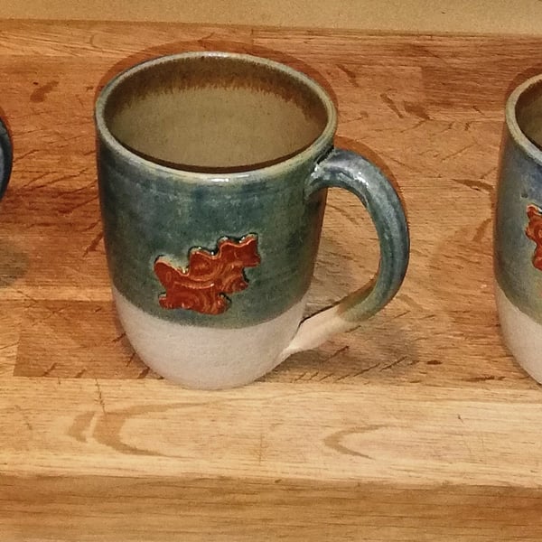 Generous and beautiful oak leaf decorated stoneware mugs