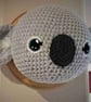 Crocheted koala trophy head on wooden board