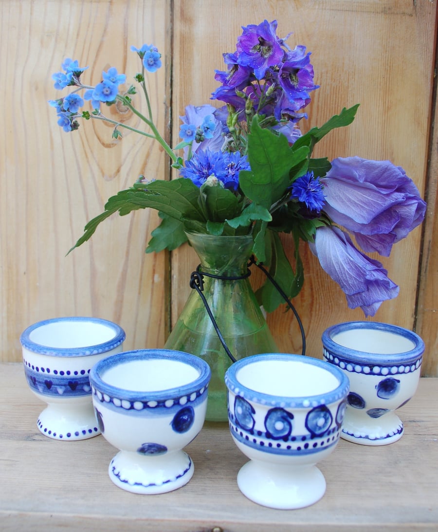 set of 4 blue and white egg cups