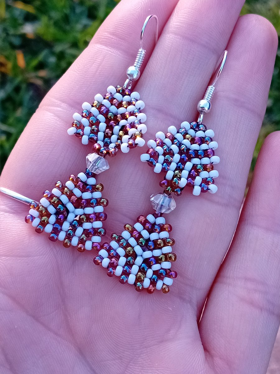 White and rainbow bronze, purple and orange tribal spiral dangle earrings