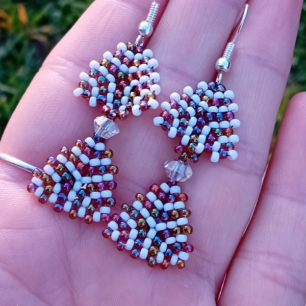 White and rainbow bronze, purple and orange tribal spiral dangle earrings
