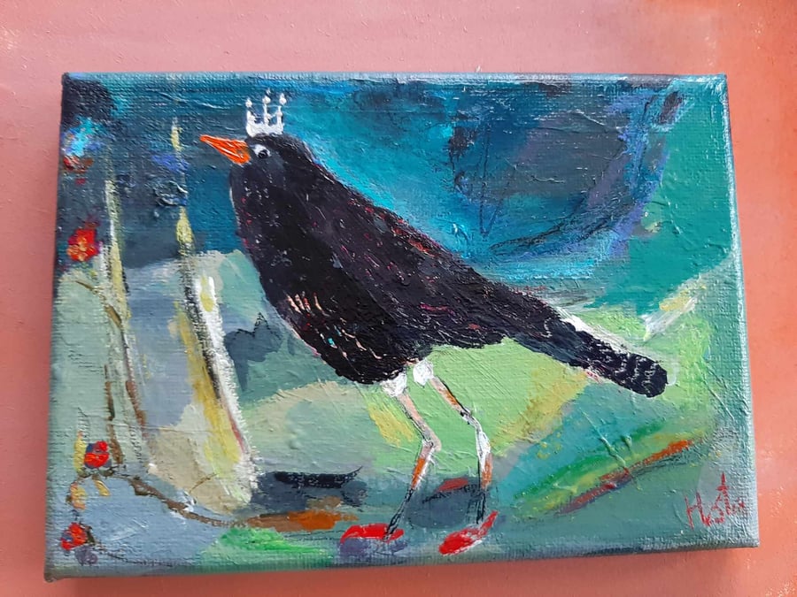 Black bird wearing a tiara and red slippers