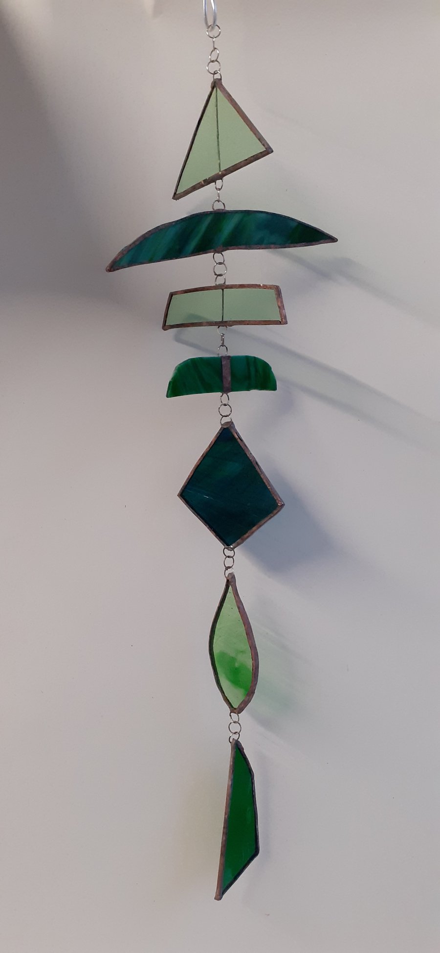 Stained glass mobile in shades of green