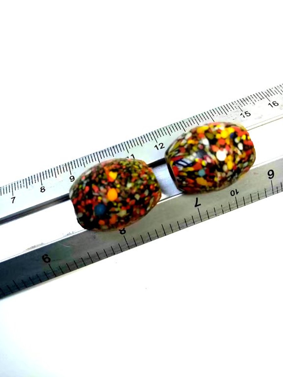 Two giant end of day barrel shaped splatter beads