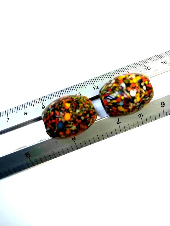 Two giant end of day barrel shaped splatter beads
