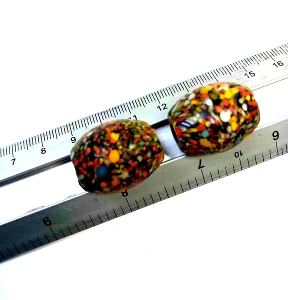 Two giant end of day barrel shaped splatter beads