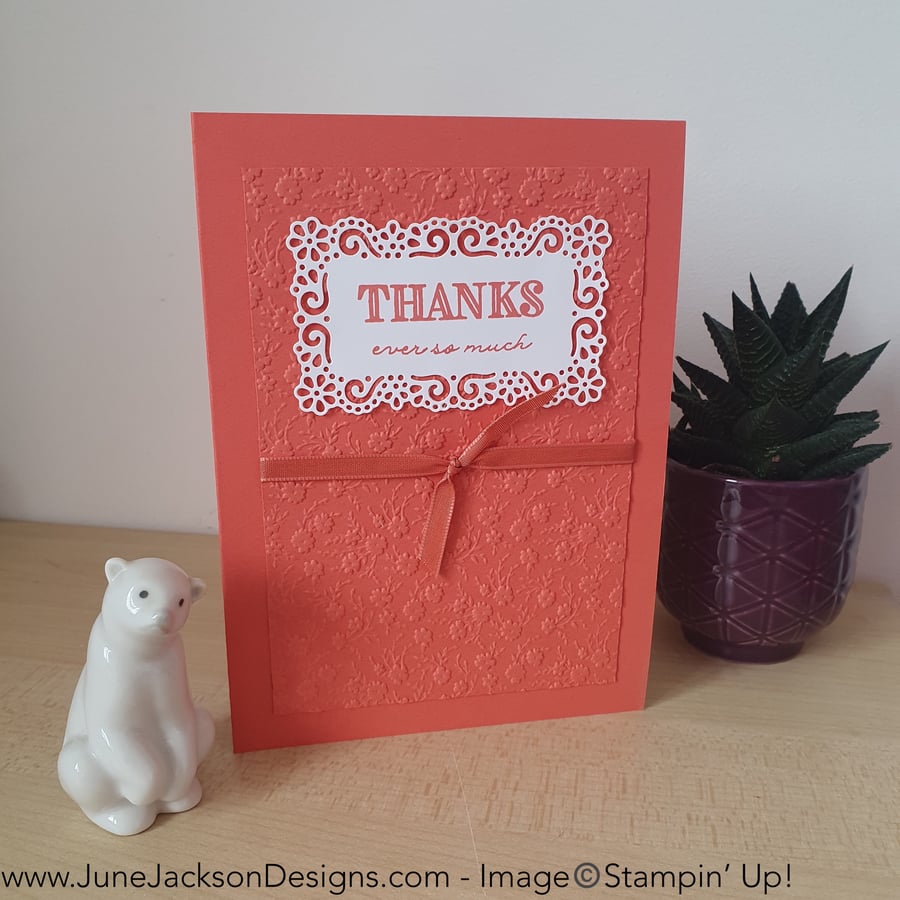 An ornate floral embossed thank you card