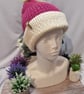 Knitted childs pompom hat in light Burgundy  - Image 1