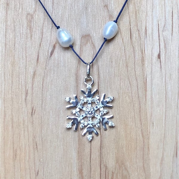 Silver and cubic zirconia snowflake necklace with freshwater pearls