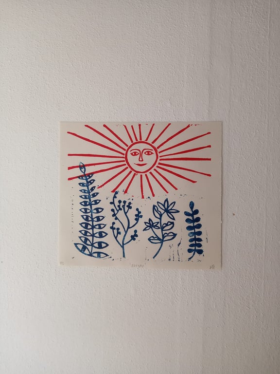 Harvest, folk art linocut print of a sun and weadow in red and blue