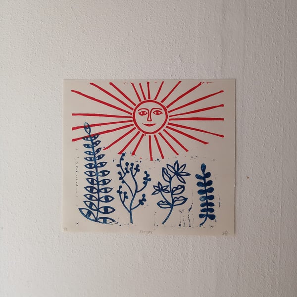 Harvest, folk art linocut print of a sun and weadow in red and blue