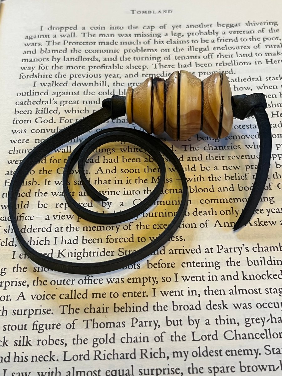 Hand turned Yew wood with leather bookmark.