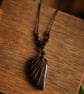 Handmade macrame necklace with Tiger Eye feather