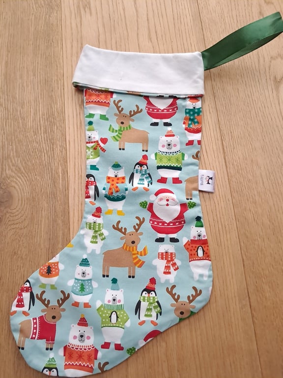 Christmas stocking with animals and Father Christmas