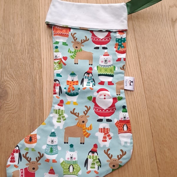Christmas stocking with animals and Father Christmas