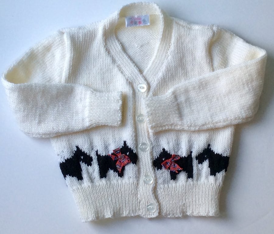 Baby cardigan hand knitted with scottie dog border