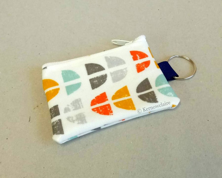 Mini coin purse key ring in white, orange and aqua