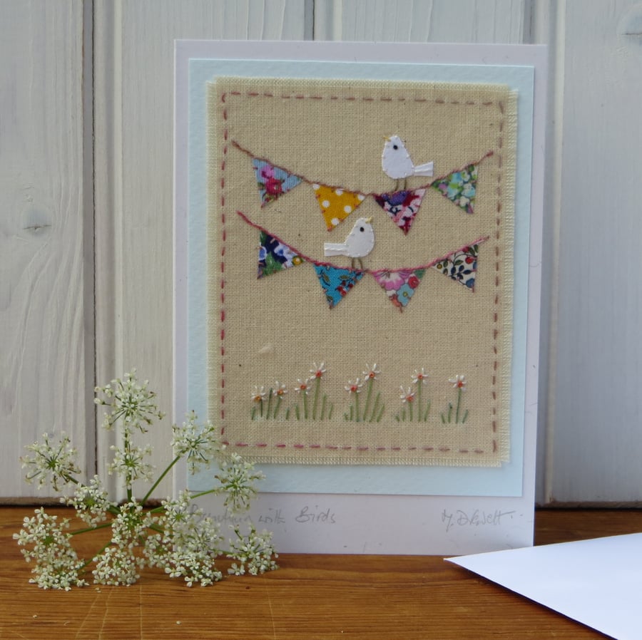 Hand-stitched mini bunting, little white doves, pretty card to keep!