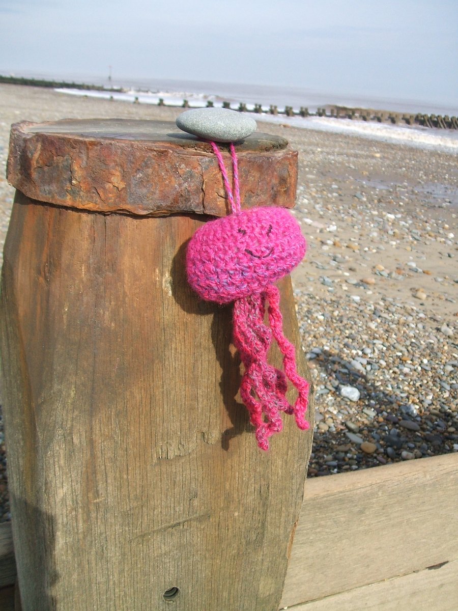 Bright pink crocheted jellyfish