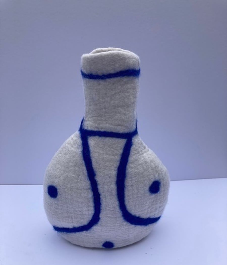 Blue and white felted long necked vase.
