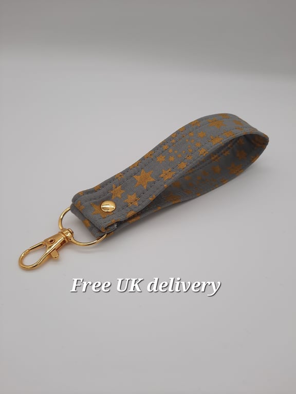 Key fob wristlet - grey with gold stars. Sale. 
