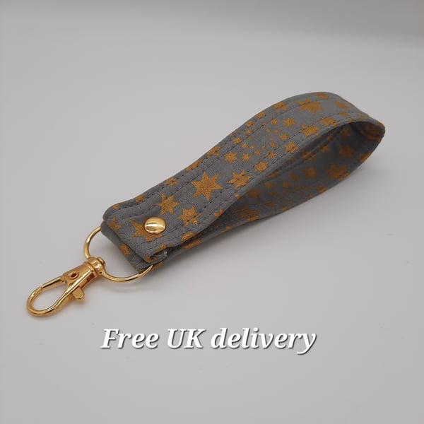 Key fob wristlet - grey with gold stars.