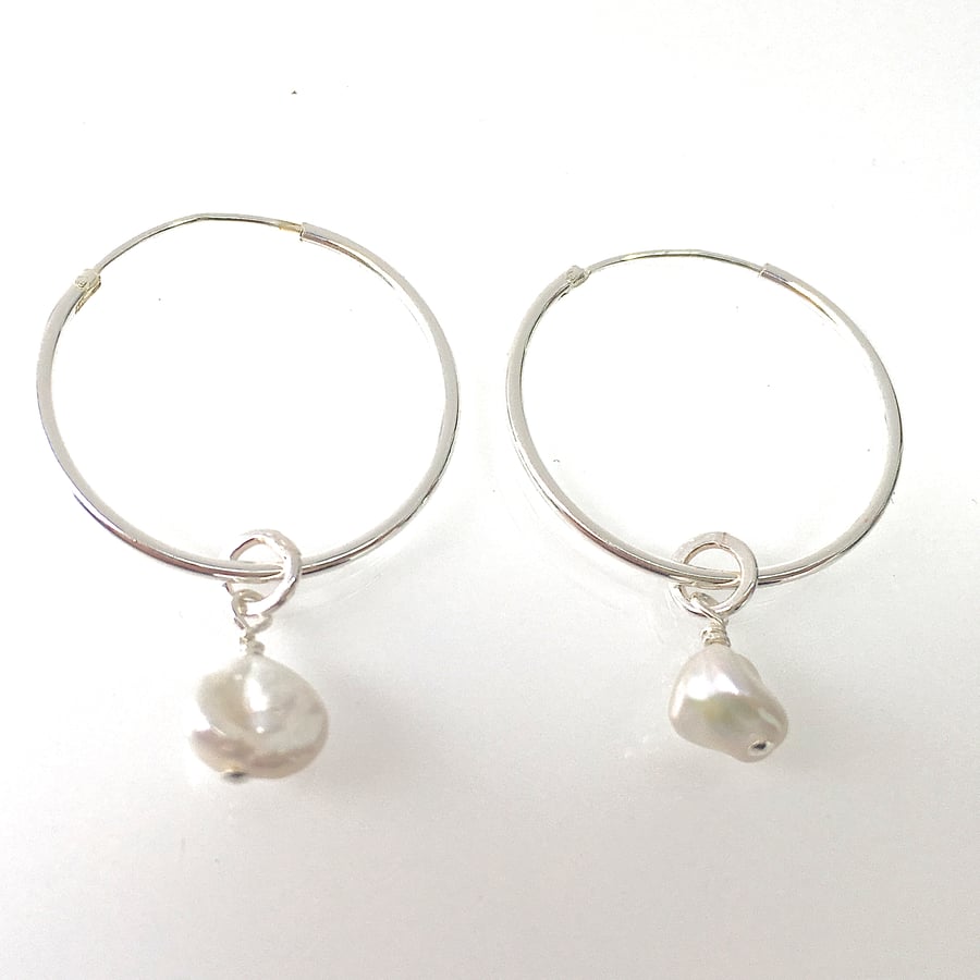 Hoop and pearl earrings