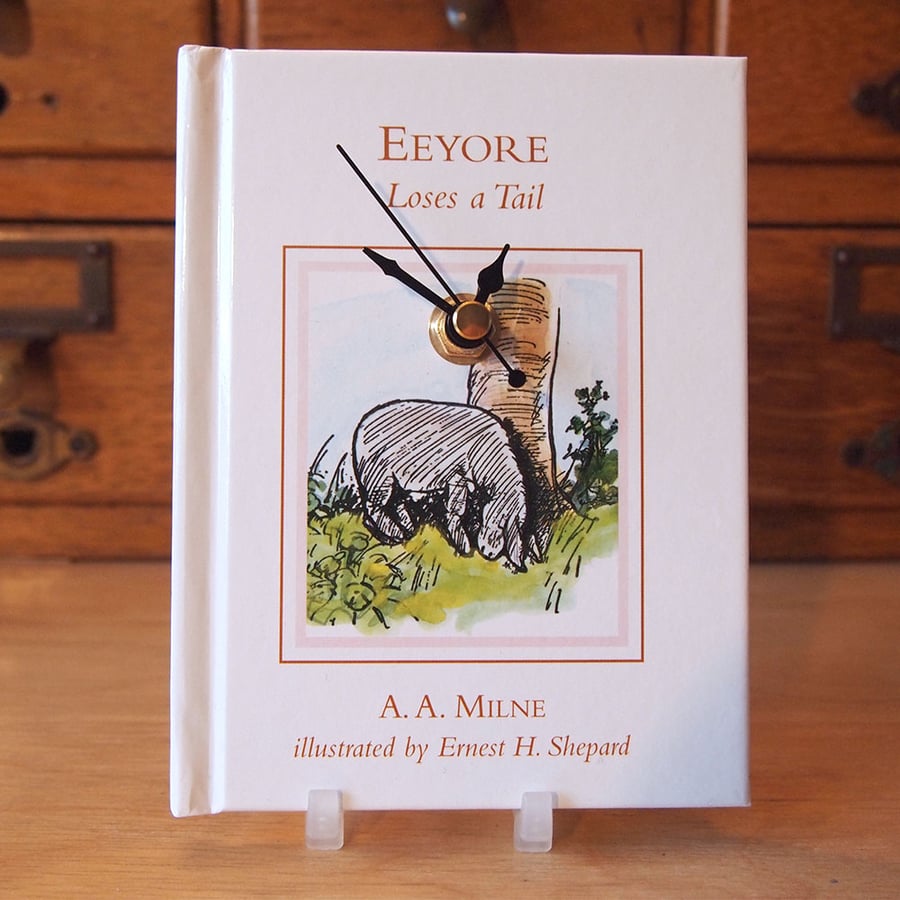 Winnie The Pooh book clock, featuring Eeyore Loses A Tail by A. A. Milne.