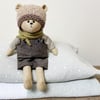 Clayton, a handmade cloth teddy bear.