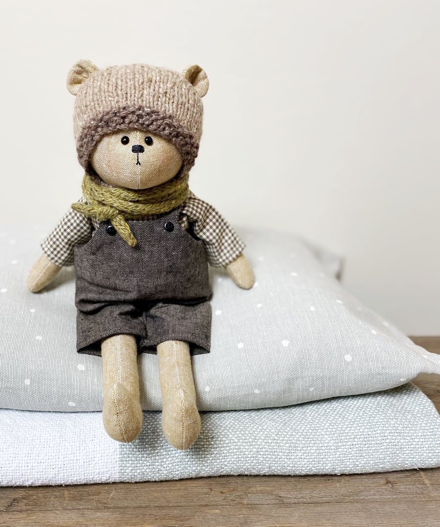 Clayton, a handmade cloth teddy bear.