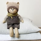 Clayton, a handmade cloth teddy bear.