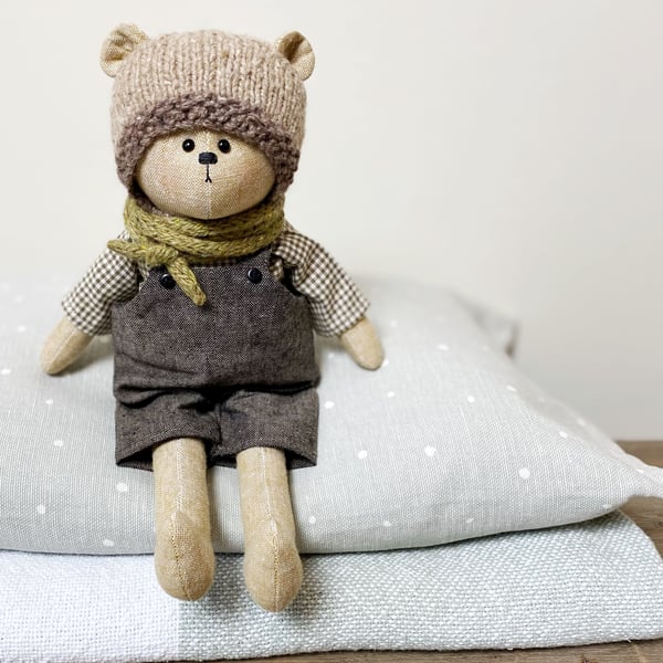 Clayton, a handmade cloth teddy bear.