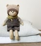 Clayton, a handmade cloth teddy bear.