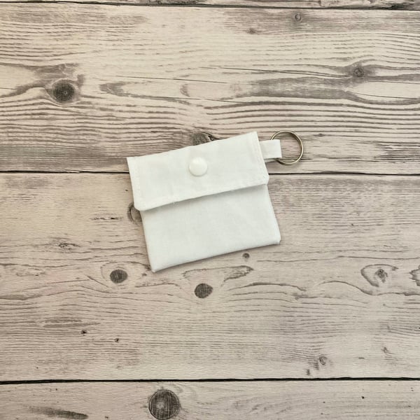 Plain white colour round lip balm keyring, keychain. Lipstick holder.