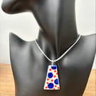 Handmade porcelain navy and orange pendant on a pale blue grey cord necklace