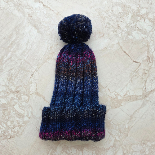 Hand knitted adult blue multicoloured bobble hat