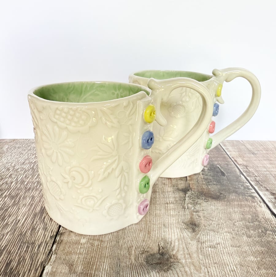 Handmade porcelain button mug. Cup.