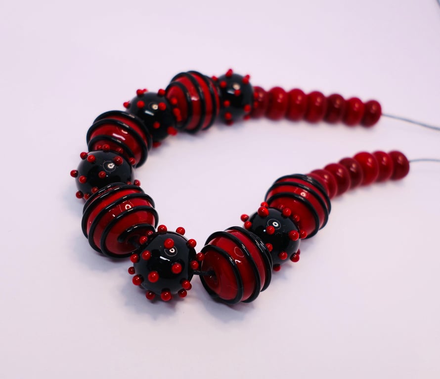 Handmade red and black lamp work glass beads