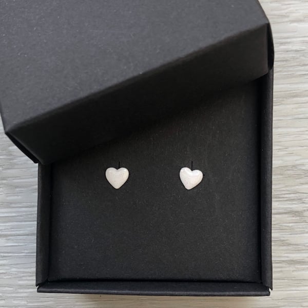 White enamel heart studs. Sterling silver studs.