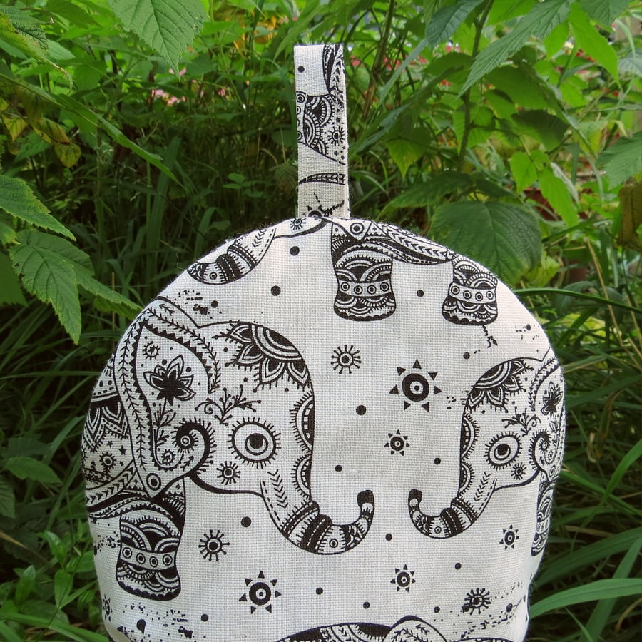 Elephants.  A coffee cosy, size small.  To fit a 2 cup cafetiere.  Cafetiere cos