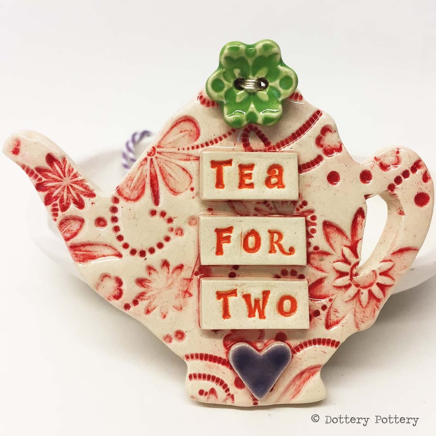 Ceramic teapot decoration with flower button pottery