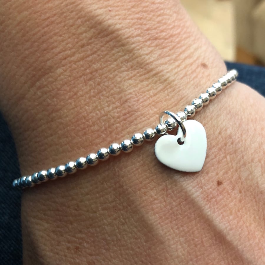  White enamel heart on silver beaded stretch bracelet. Stacking bracelet.